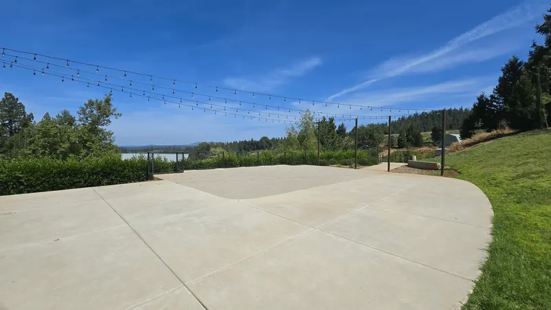 Outdoor event space with string lights overlooking Apple Hill at Morton Family Cellars